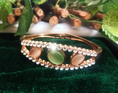 B0116_Elegant metal base color  bracelet studded with vibrant stones (Free size).