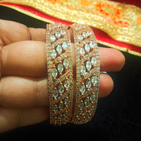 B0157_Elegant design Rose gold bangle studded with American Diamond stones.
