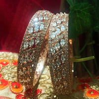 B0157_Elegant design Rose gold bangle studded with American Diamond stones.