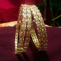 B0162_Gorgeous Golden crafted bangles with a touch of  American Diamond stones.