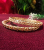 B0164_Elegant Golden sleek bangles studded with a touch of American Diamond stones.