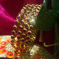 B0154_Elegant pink ruby studded bangles with fine stone work.