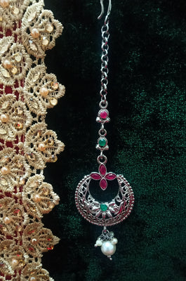 M09_Gorgeous Pink & Green ruby stone studded silver base color Circular shaped Maang Tika with touch of pearls.