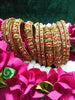 B0167_Gorgeous traditional style Matte finish designer golden bangle set studded with semi precious red & golden stones.