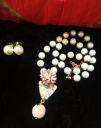 N0263_Lovely pearl necklace set studded with dazzling triangular stone with flower design with a bead drop.