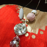 N0258_Trendy long dazzling stone work necklace with a touch of lovely beads with a woolen ball along with a sleek chain.