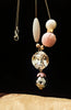 N0258_Trendy long dazzling stone work necklace with a touch of lovely beads with a woolen ball along with a sleek chain.