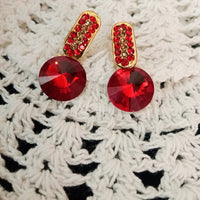 E0594_Lovely Stone work studs with a dazzling over sized red stone.