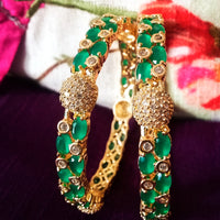 B0176_Gorgeous golden bangles embellished with American Diamond stones with a touch of green stones.
