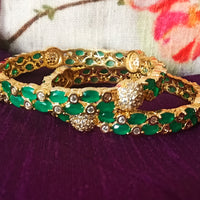 B0176_Gorgeous golden bangles embellished with American Diamond stones with a touch of green stones.