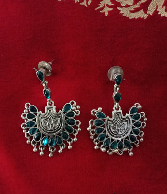 E0620_Lovely German Silver oxidized crafted danglers with beautiful design studded with blue stones along with a touch of black stones & bead drops(Medium size).