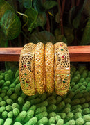 B0181_Gorgeous traditional style Matte finish gold plated bangles set with a touch of stones.