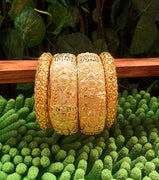B0180_Gorgeous traditional style Matte finish gold plated bangles set.