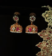 E0636_Beautiful Golden color crafted jumkas embellished with a touch of pink stones.