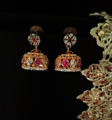 E0636_Beautiful Golden color crafted jumkas embellished with a touch of pink stones.