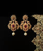 E0642_Gorgeous crafted earrings with delicate work of peacock design studded with american diamond stones with a touch of pink stones.