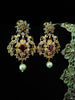 E0642_Gorgeous crafted earrings with delicate work of peacock design studded with american diamond stones with a touch of pink stones.