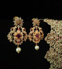E0642_Gorgeous crafted earrings with delicate work of peacock design studded with american diamond stones with a touch of pink stones.