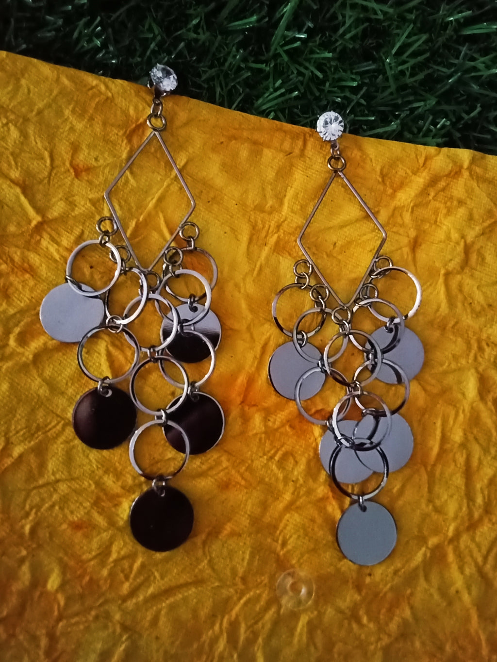 E0649_Trendy designer diamond shaped danglers with a touch of shiny disc shaped ring patterns & stone work.