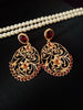 E0651_Classic golden color earrings studded with red stones with delicate craft work.