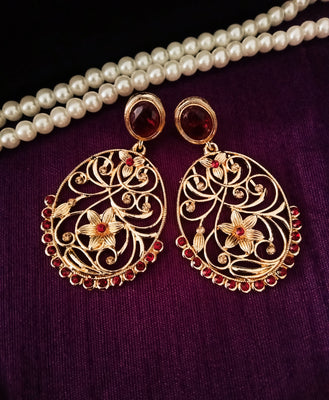 E0651_Classic golden color earrings studded with red stones with delicate craft work.