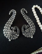 E0652_Classic german silver oxidized crafted peacock design danglers with delicate craft work studded with a touch of stones.