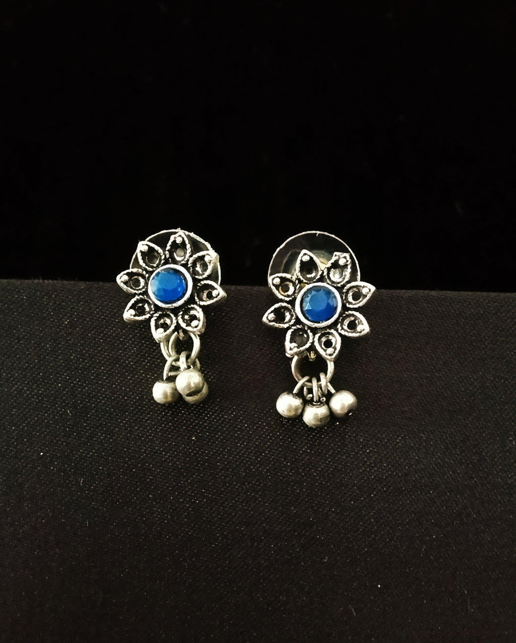 E0661_Lovely german silver oxidized flower design earrings with a touch of blue stones and bead drops.