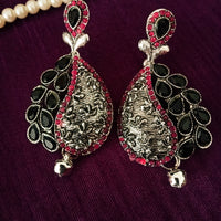 E0664_Classic german silver oxidized danglers studded with a touch of pink & black stones along with bead drop.