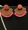 E0692_Dazzling grand stone studded earrings with a delicate stone work with a touch of pink bead drops.