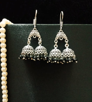 E0696_Classy german silver oxidized twin jumkas with delicate craft work with a touch of black bead drops.