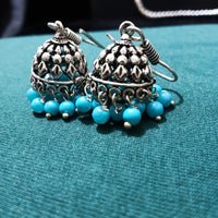 E0697_Classy german silver oxidized jumkas with delicate craft work with a touch of blue bead drops.