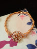 B0182_ Gorgeous golden base bracelet studded with semi precious stones with delicate work.