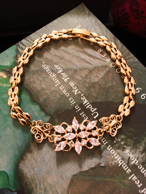 B0183_ Gorgeous golden base bracelet studded with semi precious stones with delicate work.