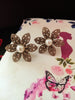 E0710_Lovely crafted flower design studs with delicate work with a touch of pearls.