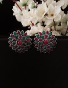 E0741_Classy german silver oxidized studs with delicate patterns with a touch of green and pink stones.