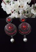 E0742_Classy german silver oxidized earrings with a touch of dazzling red stones with a pearl drop.