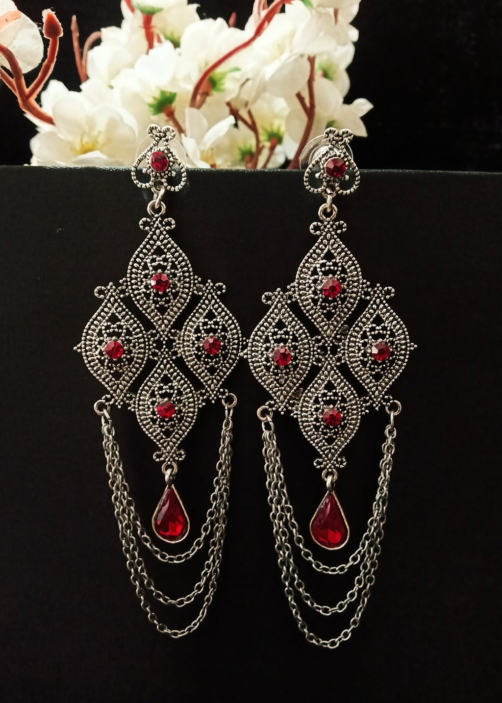 E0773_ Classy crafted diamond shaped German silver oxidized chain drop danglers with a touch of stones.
