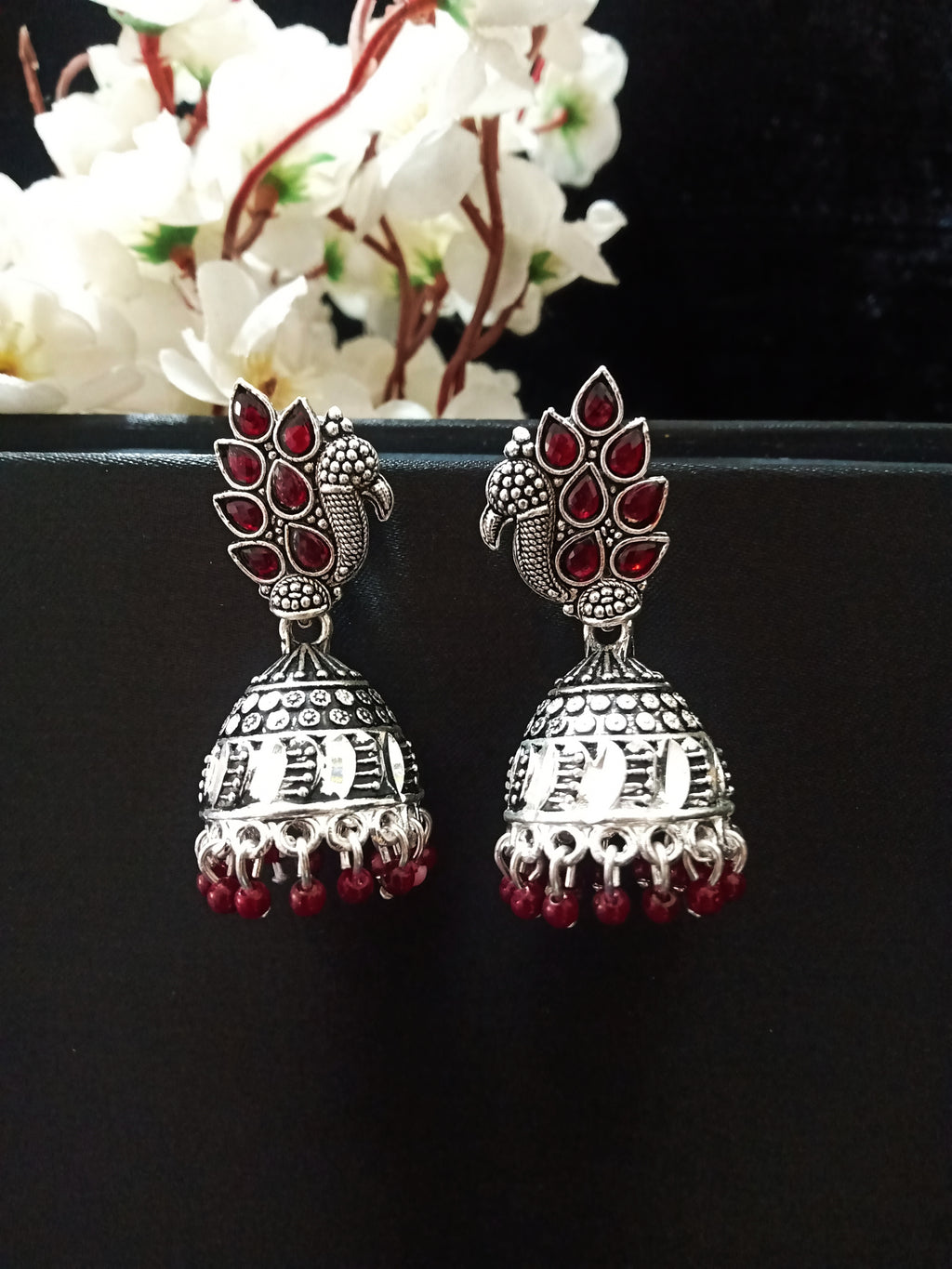 E0787_Gorgeous oxidized peacock design jumkas with a touch of bead drops studded with dazzling stones.