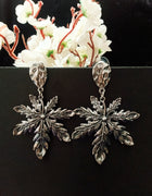 E0793_Trendy crafted leafy design danglers with delicate work.