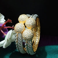 B0184_Classy style bangles studded with american diamond stones with delicate craft work.