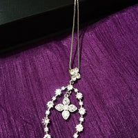N0269_Elegant trendy long necklace with a touch of sparkling stones oval shaped pendant with flower designs.