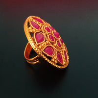 R027_Gorgeous circular shaped golden color rings with a touch of semi precious pink ruby  stones.