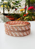 B0157_Elegant design Rose gold bangle studded with American Diamond stones.