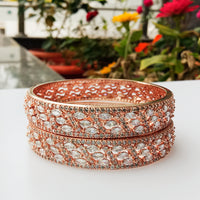 B0157_Elegant design Rose gold bangle studded with American Diamond stones.
