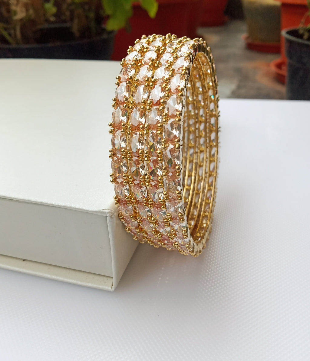 B0162_Gorgeous Golden crafted bangles with a touch of  American Diamond stones.