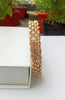 B0164_Elegant Golden sleek bangles studded with a touch of American Diamond stones.