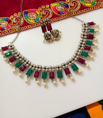 N0285_Classic German Silver Oxidized choker necklace set with delicate work studded with semi precious stones with a touch of pearl drops.