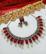 N0286_Classic crafted German Silver Oxidized red color choker necklace set with delicate work studded with semi precious stones with a touch of pearl drops.