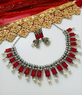 N0286_Classic crafted German Silver Oxidized red color choker necklace set with delicate work studded with semi precious stones with a touch of pearl drops.