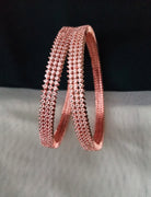 B0197_S_Elegant sleek rose gold bangles engraved with American Diamond stones with delicate stone work.